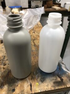 Packaging materials and designs need improved properties, as consumers pressure brand owners for greater quality and sustainability. Shown are test bottles in Baerlocher lab. 