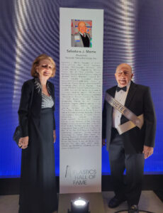 Monte’s standing in the industry was recognized when he was inducted into the Plastics Hall of Fame in 2021. Sal and Erika stand by the list of his accomplishments at the ceremony. 