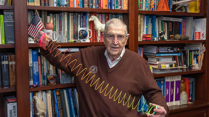 A trove of industry history: Glenn Beall’s office sports an eclectic collection of plastics applications, artifacts, books and toys like the polymer Slinky he is holding. Photos courtesy of Mark Richardson, Series1One