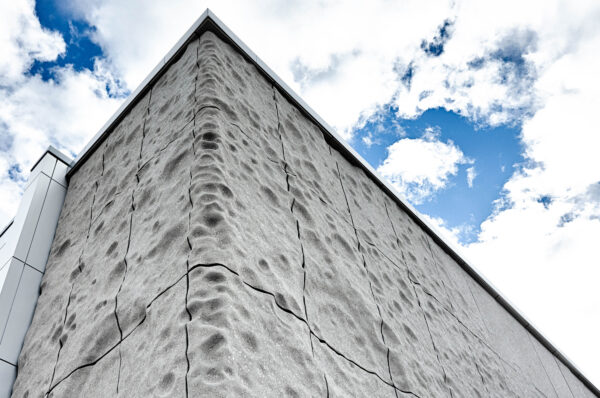 The façade of NASA’s Space Camp building has 3D-printed panels from Branch Technology depicting the lunar surface. 