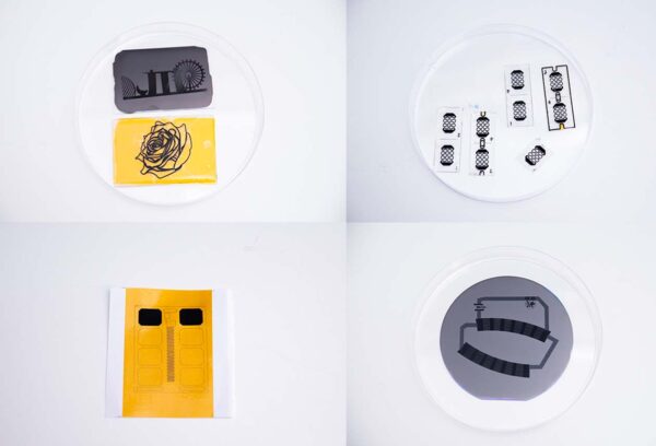 3D-printed graphene structures on glass and flexible rubber substrates (top row). A pre-design graphene layer on a paper and silicon base (bottom). 