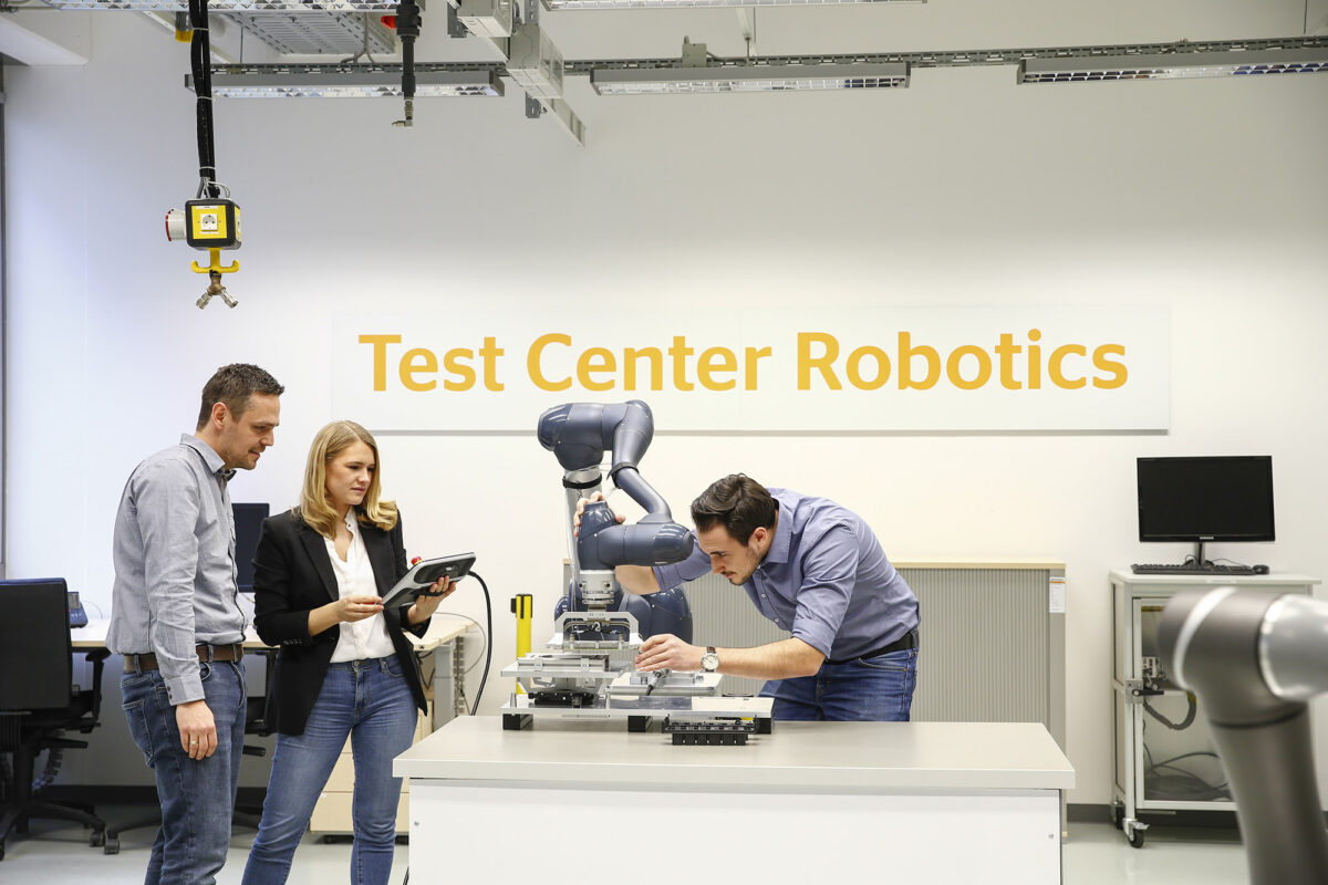 Continental engineers test a cobot in Regensburg, Germany, that will assemble automotive electronics.