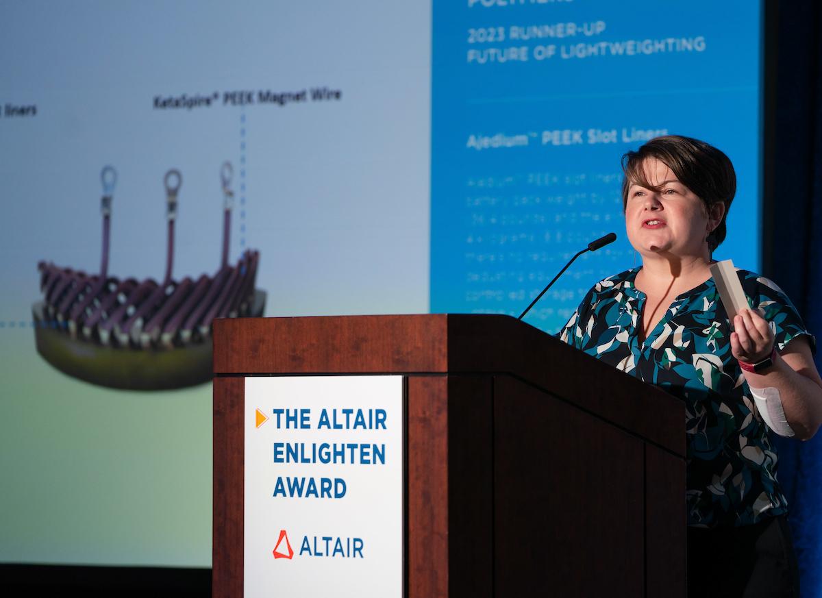 Dr. DeeDee Smith, Solvay’s e-mobility marketing manager, holds award-winning Ajedium PEEK film slot liner in her hand.