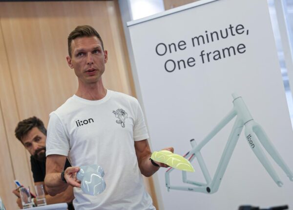 Tony Martin displays sample bike seats at the launch event. 