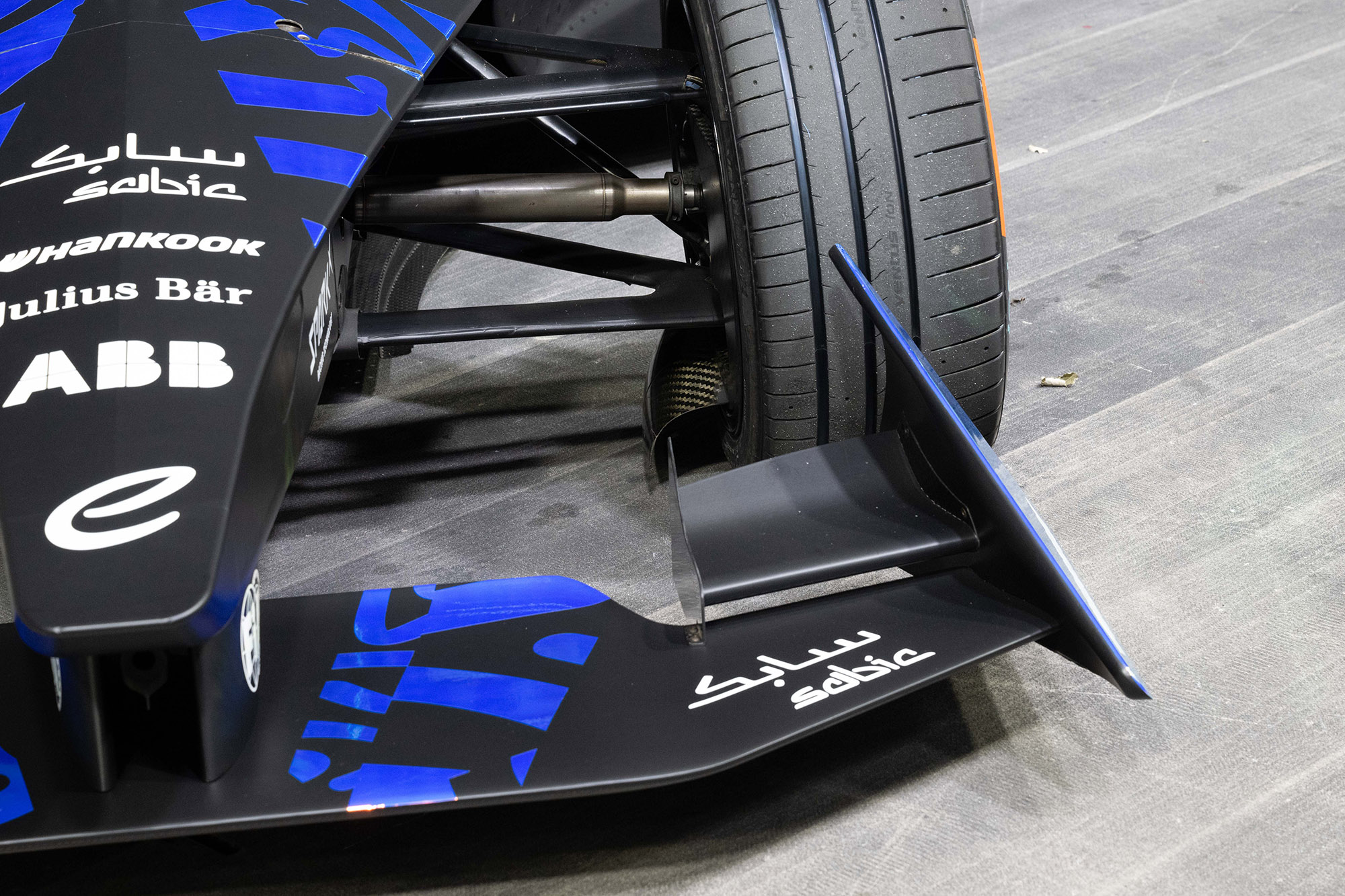 3D-printed endplates on the outboard extremities of the front wing redirect airflow around the wheels to reduce drag and improve racecar’s downforce and stability. 