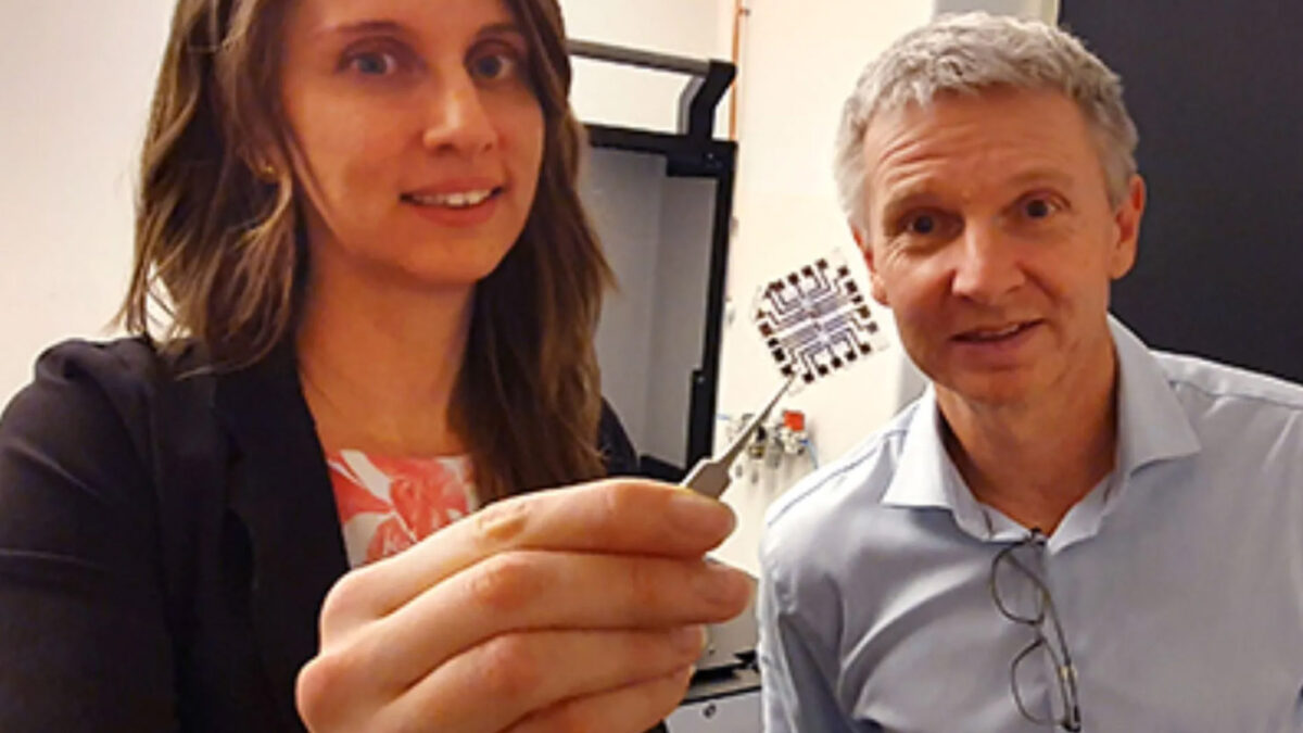 Erica Zeglio, left, shows a finished transistor. At right is Professor Frank Niklaus.