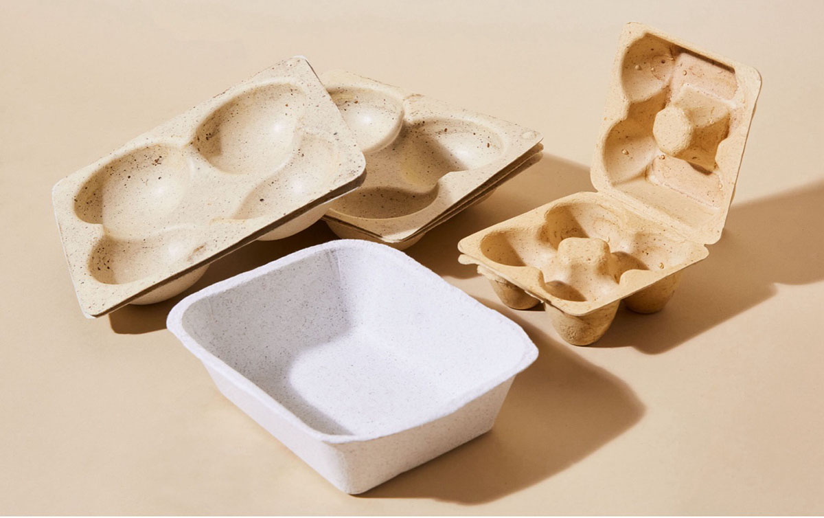 PlantSea blends seaweed with a mix of wood pulp to make food cartons such as these. The resulting molded products are home compostable and can be recycled in the usual paper channels.