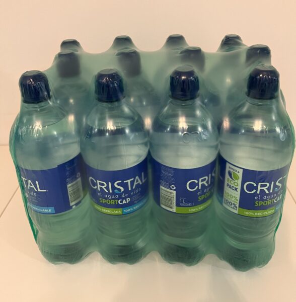 Bottles with shrink films of advanced resins and recycled plastic. Image Right: Plastilene.