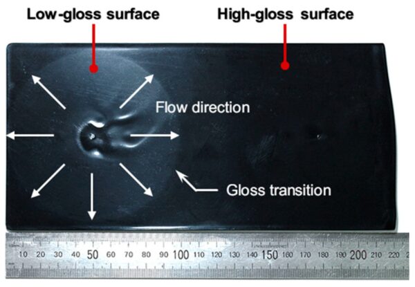 Example of the gloss defect on a high-gloss injection-molded surface. Courtesy of Causes of the Gloss Transition Defect on High-Gloss Injection-Molded Surfaces.