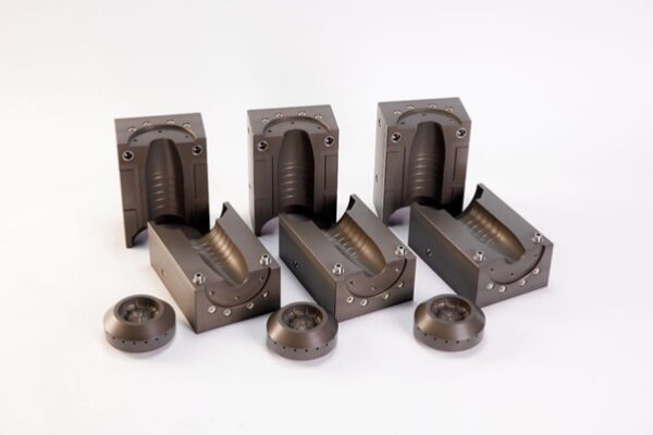 A notable case was in Slovakia, where PET Technologies produced interchangeable bottom sets for blow molds. That allowed the customer to switch easily between bottles for still and sparkling water with minimal setup changes. Courtesy of PET Technologies.