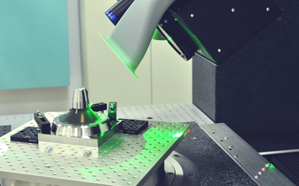 Laser workstation applying texture to a mold insert. The process creates controlled micro- and nano-scale geometries on the cavity wall, transforming surface finish from a cosmetic detail into a functional interface that governs polymer flow, release, and durability. Courtesy of LightMotif.