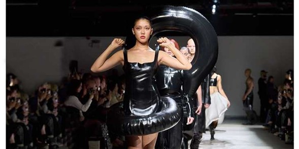 High-gloss PVC, welded and pressurized into wearable structure, shows how a soft film can act like an engineered component on the body. Courtesy of Elle.