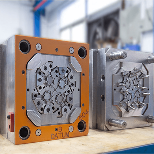 Conventional machined metal inserts are used in standard injection-molding tooling. These assemblies form the performance baseline that high-temperature photopolymer inserts aim to replicate in short-run production. Courtesy of LSR Mold.
