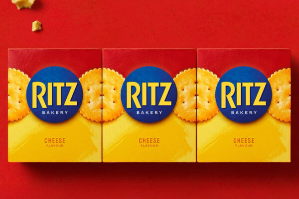 Ritz's redesign demonstrates brand blocking's power to dominate shelf space. The unified pack architecture system creates visual patterns that complete across adjacent products, transforming individual packages into a cohesive territorial presence. This wallpaper effect amplifies the brain's pattern recognition capabilities, making the brand register as a single dominant entity rather than scattered SKUs. Design by Bulletproof.