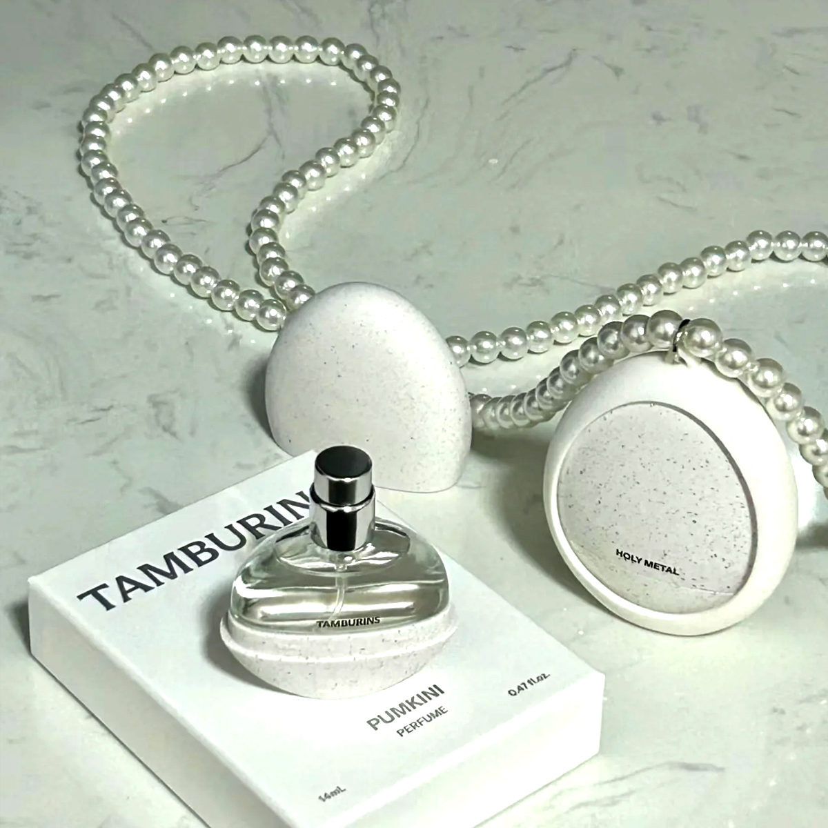 Tamburins Pumkini beauty packaging with minimalist form and restrained materials optimized for social media photography