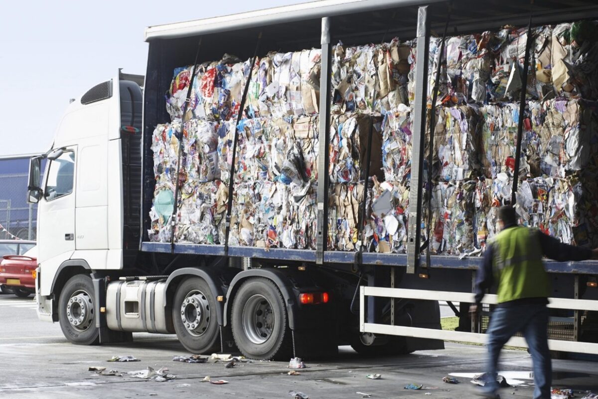 Mechanical recycling begins on the road, not on the plant floor. Collection and transport logistics determine feedstock quality before a single bale reaches a sorting facility, making fleet infrastructure and route design as critical to circularity as any processing technology. Courtesy of Waller.