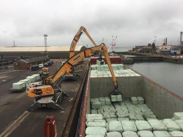 Recycling scale is a logistics problem as much as a technology problem. The volume of post-consumer plastic bales a facility can source, ship, and process reliably sets the ceiling on how much recycled resin the circular economy can deliver. Courtesy of JST Service.