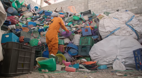 Image of Kubik’s labor force during the plastic collection and sorting process. Courtesy of the 28th United Nations Climate Change Council Conference.