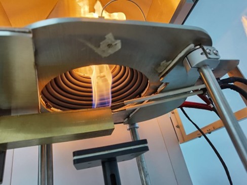 Cone calorimetry measures reaction-to-fire behavior in polymer materials, including ignition time, heat release rate, smoke production, and mass loss under controlled radiant heat exposure. Courtesy of Motis.