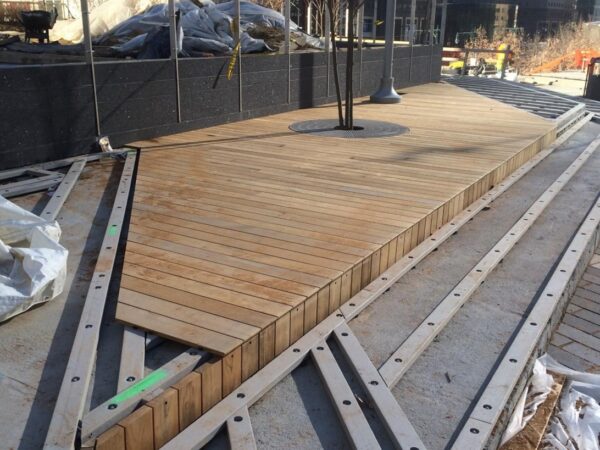 Decking profiles face coupled weathering mechanisms in service, including UV oxidation, moisture exposure, thermal cycling, surface wear, and creep under sustained loads. Courtesy of American Recycled Plastics.